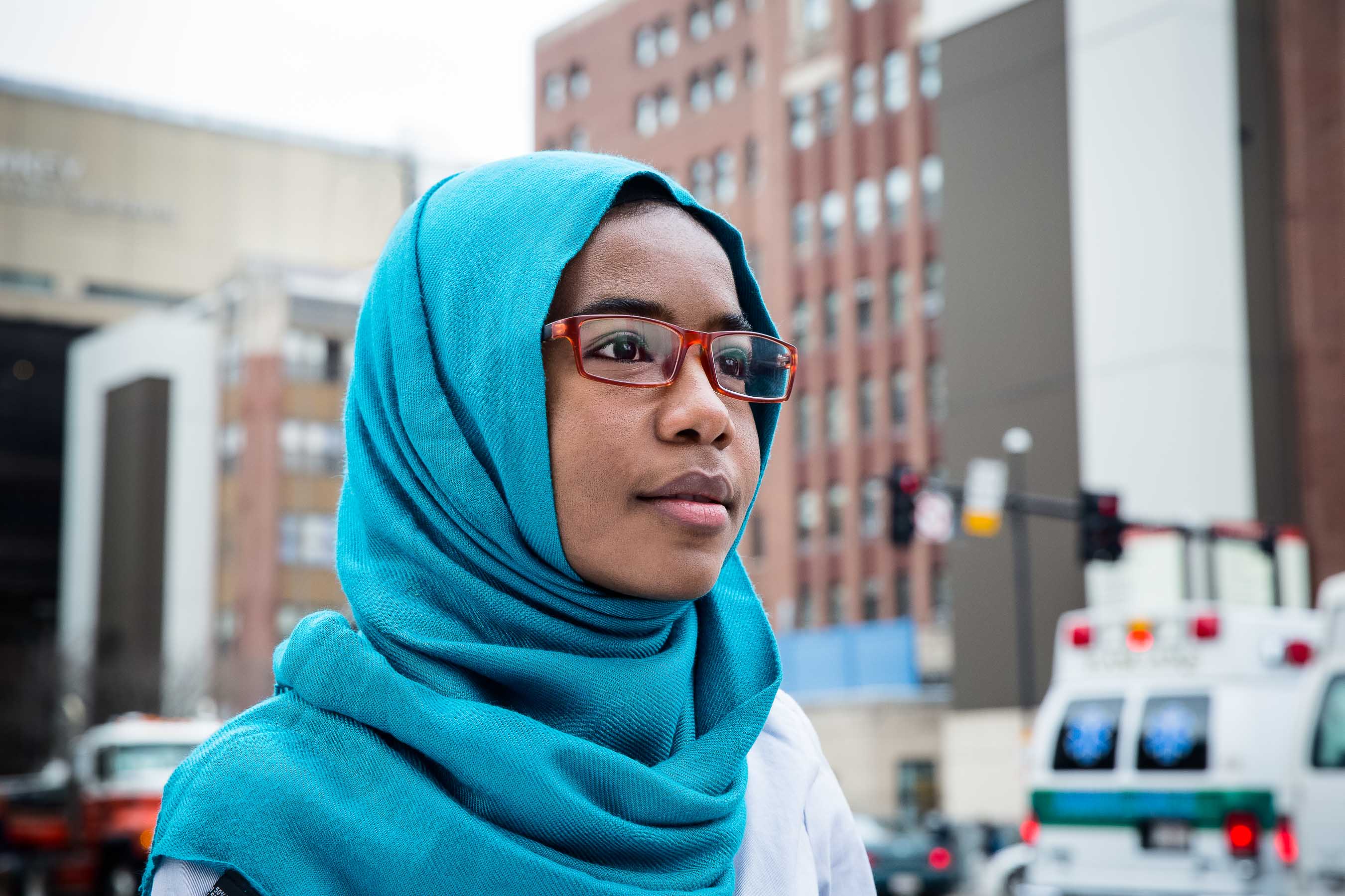Portrait of healthcare academic outside with ambulance